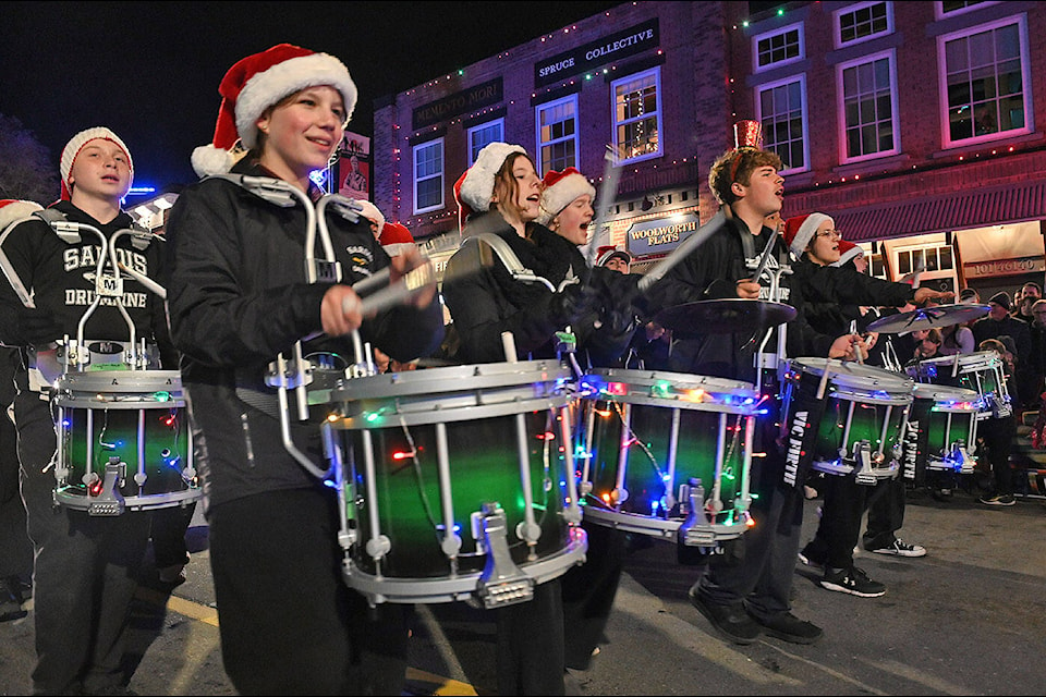 The Sardis Drumline takes part in the annual Rotary Christmas Parade in downtown Chilliwack on Saturday, Dec. 2, 2023. (Jenna Hauck/ Chilliwack Progress) 