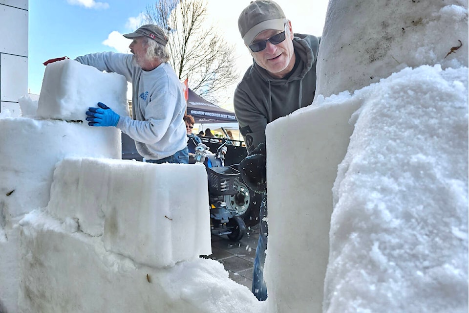 On Saturday, Dec. 2, a clear day with no snow on the ground, David Dureault and Bruce Waugh (right) built a snow fort at the Timms Magic of Christmas festival. (Dan Ferguson/91ԭ Advance Times) 