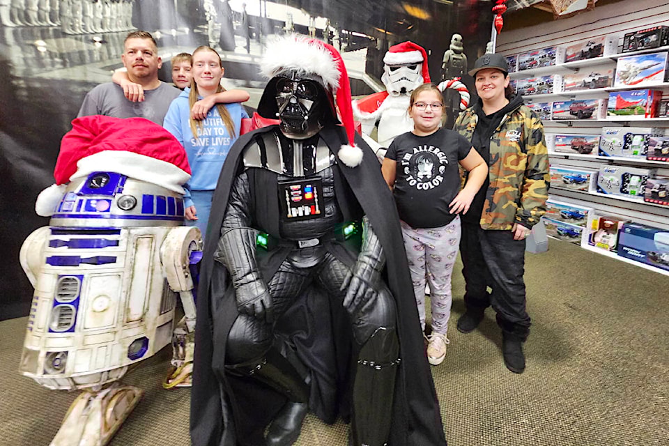 Coquitlam’s Kazakoff family was first in line to have their picture taken with Santa Vader at Toy Traders in 91ԭ on Sunday, Dec. 3, a fundraiser that collected more than $2,500 in donations over five hours for the 91ԭ Shrine Club. (Dan Ferguson/91ԭ Advance Times) 