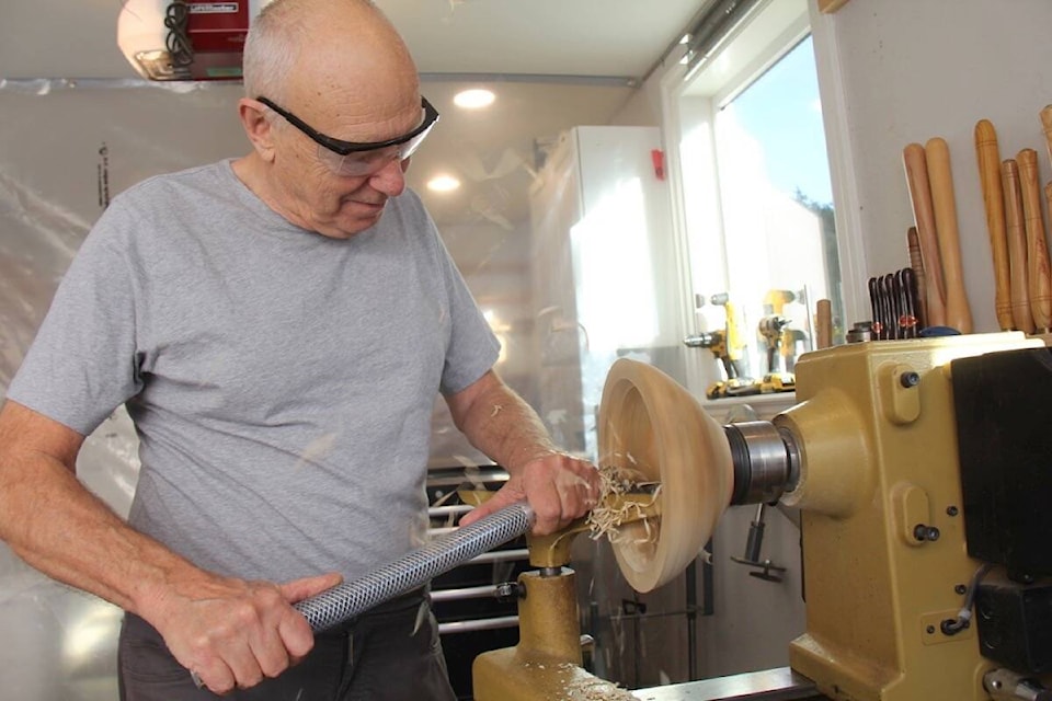 Victoria wood turner Peter Hackett turns a piece in his Rockland home studio. (Christine van Reeuwyk/News Staff) 