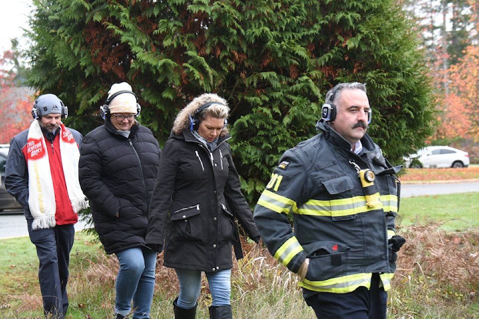 Salvation Army Major Michael Ramsay, left, Angeline Street from the Community Action Team, Lisa George from Salvation Army and Port Alberni Fire Chief Mike Owens participate in the Walk With Me workshop on Tuesday, Nov. 28, 2023. (SUSAN QUINN/ Alberni Valley News) 