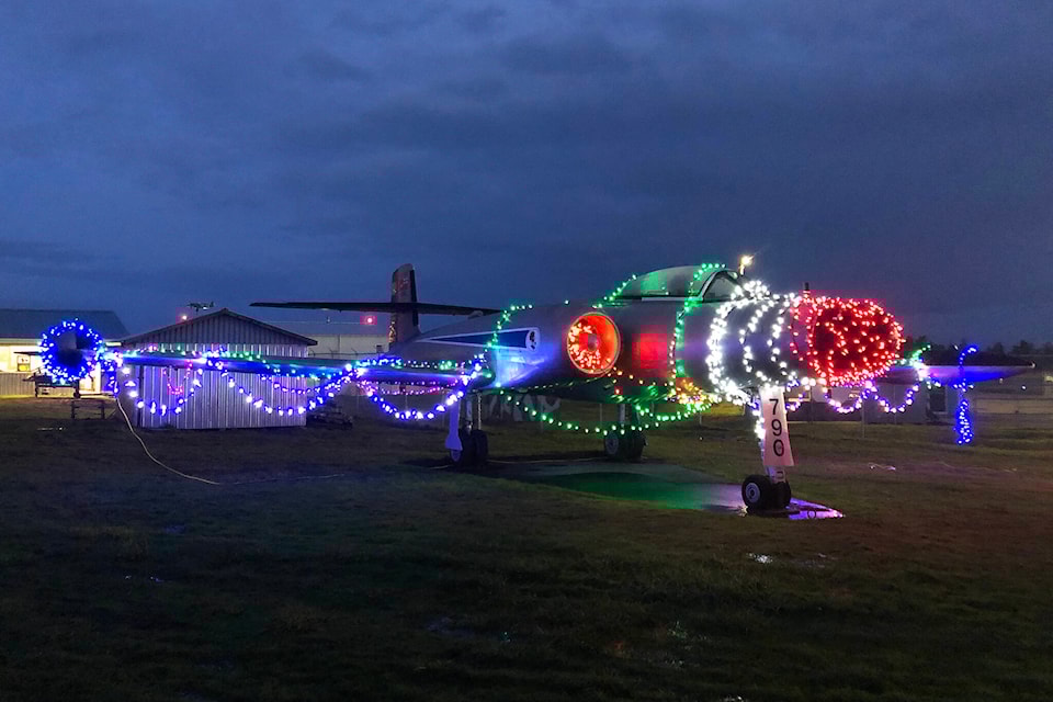 Members of 19 Wing Comox have decorated the vintage aircraft in festive lights again this year. (Olivier Laurin / Comox Valley Record) 