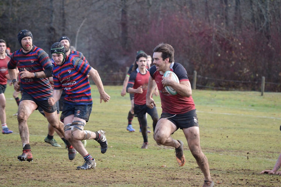 Comox Valley Kickers centre Devon Moore breaks through the line in the Dec. 2 match against the Castaway Wanderers. Photo by Natalie Nguyen 