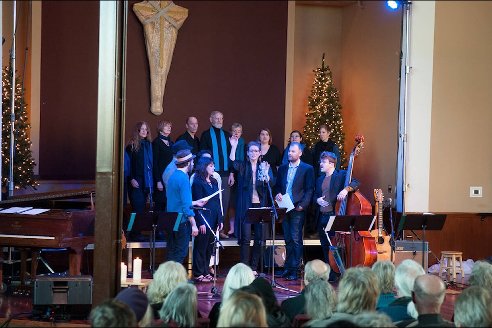 Cari Burdett, along with Lila Community Choir and Winter Solstice Musicians perform. (Photo by Kelly Etheridge) 
