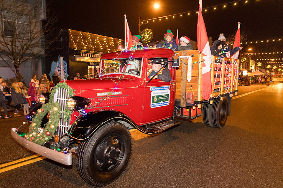 A classic truck, from Cloverdale’s inimitable B.C. Vintage Truck Museum, rolls along 176th Dec. 3 as part of the 16th annual Surrey Santa Parade of Lights. (Photo: Jason Sveinson) 