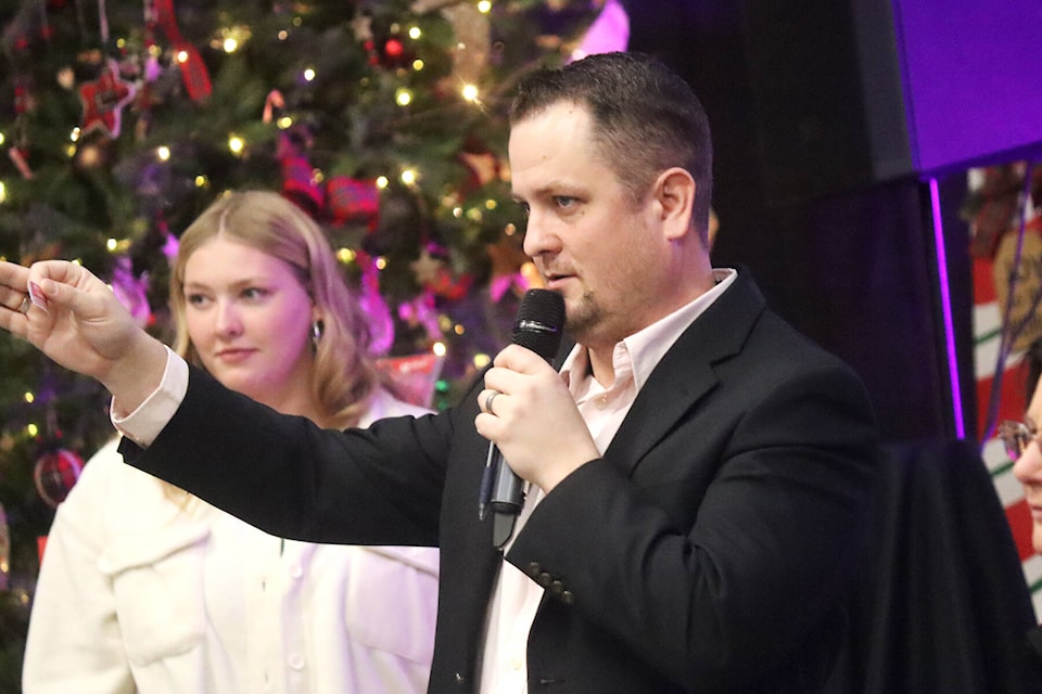 Darcy Stingel and a couple of other volunteers stepped up to help with the live auction during the Guys and Gals Blue Jean event at the Stagecoach Saloon on Dec. 2. (Photos by Emily Jaycox/Ponoka News) 