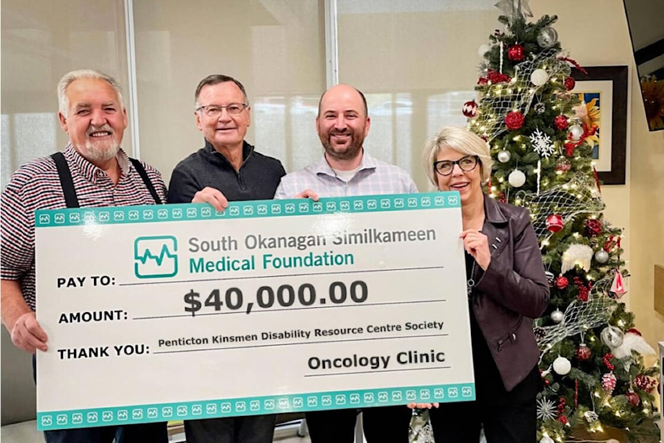 Pictured from left to right: Penticton Kinsmen Disability Resource Centre Society director Norm Dishkin and Hall Manager, Greg Flook, SOS Medical Foundation CEO Ian Lindsay and director of development Lissette Little. (Submitted) 