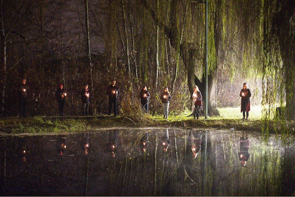 Residents honour the 14 women killed at École Polytechnique in Montreal in 1989, and Missing and Murdered Indigenous Women and Girls, during a candlelight vigil at the Salmon Arm Okanagan College campus on the National Day of Remembrance and Action on Violence Against Women, Dec. 6, 2023. (Kayleigh Seibel Photography) 