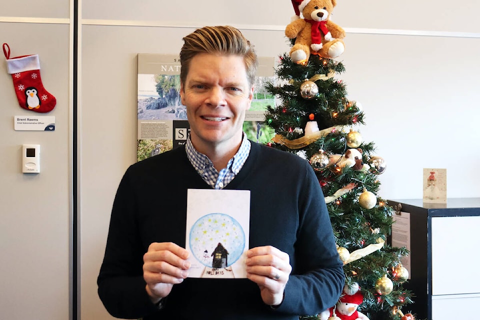 Mayor Murdock with a holiday card in 2023. (District of Saanich) 