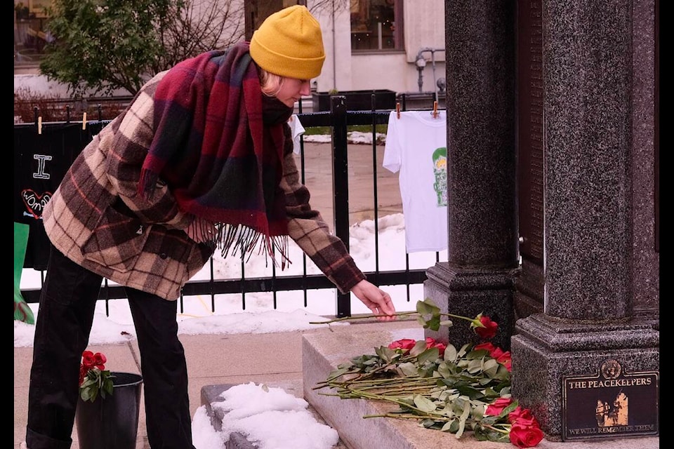 At the National Day of Remembrance and Action on Violence Against Women event in Nelson on Dec. 6, members of the public laid a rose at the cenotaph in memory of someone who has experienced gender-based violence. Photo: Bill Metcalfe 
