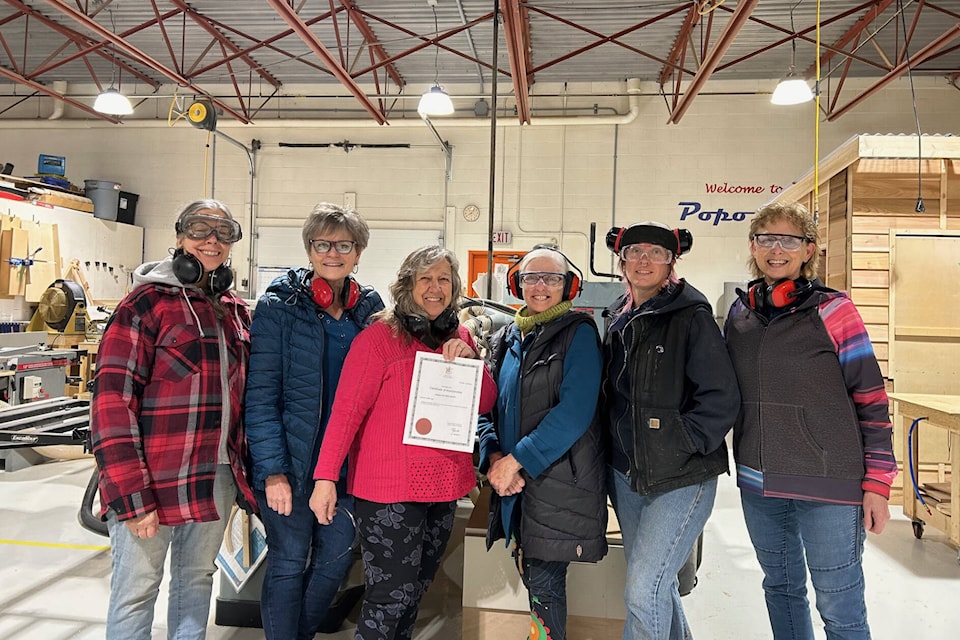 Members of the Vernon She Shed Society pose with a certificate indicating their status as a registered society. (Contributed) 