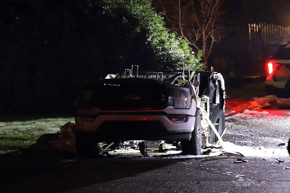 A pickup truck was reported burned on Southridge Drive in Surrey shortly after a targeted shooting in North Delta on Thursday, Dec. 14, 2023 that sent one person to hospital. Police believe the two incidents are connected. (Shane MacKichan photo) 