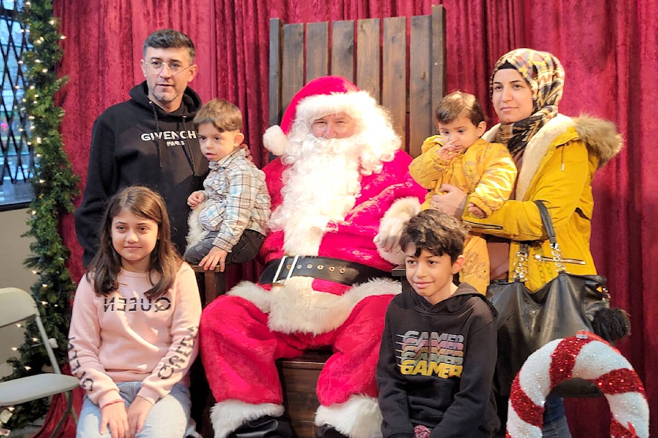 Santa was available for photos at the”Santa’s Workshop” event hosted by Southgate Church in collaboration with Raphael House to help migrant families in need on Saturday, Dec. 9. (Kyler Emerson/) 
