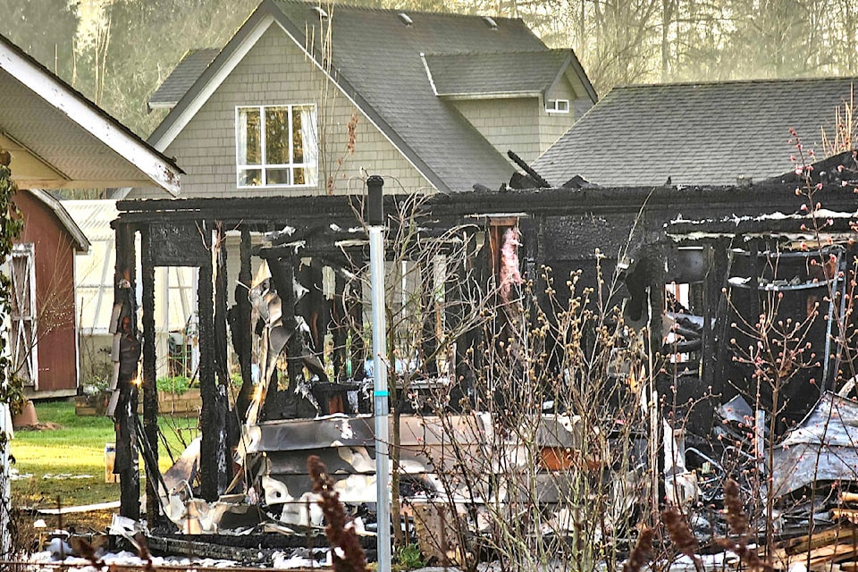  An outbuilding behind an occupied detached house burnt down in Aldergrove late Tuesday night, Dec. 19. (Dan Ferguson/Langley Advance Times) 