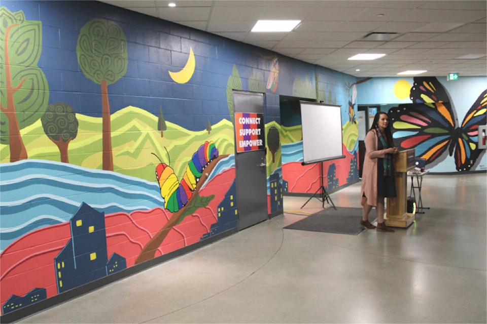 Jovonne Johnson, with non-profit Risebridge, speaks at the unveiling of a mural at Nanaimo Aquatic Centre. It was inspired by an inquiry into hate crimes during the COVID-19 pandemic. (Karl Yu/News Bulletin) 