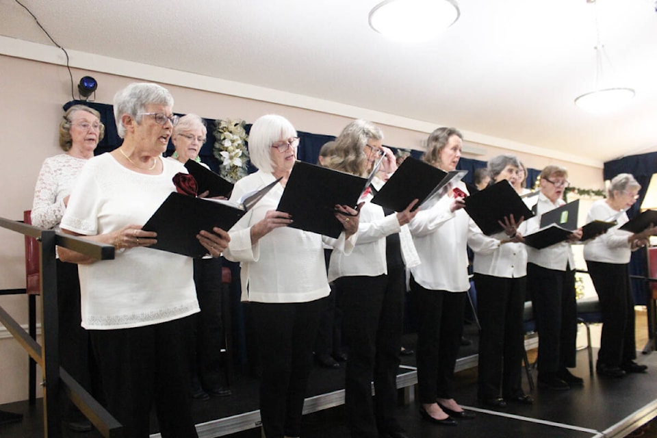 The CentreBelles ladies’ choir performs during Christmas dinner at the 55+ Activity Centre. (Photo by Don Bodger) 