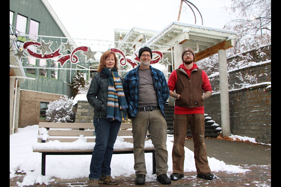 Brenda Devine (left) Eric Herl and Wyatt Herl have designed and built the Starry Nights lights display for the last decade. (Patrick Davies photo - simplymastery) 