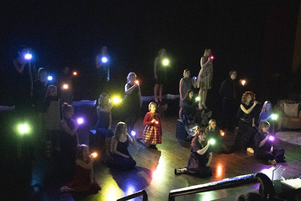 The Gracenotes, Rhapsody Girls and Tiny Tenors perform with lights to open the concert. (Kevin Sabo/Stettler Independent) 