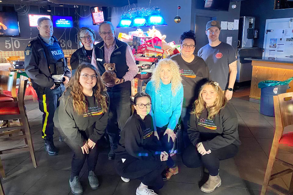 The Christmas Wish Breakfast hosted by the CDC received donated toys for those in need. From left to right in the back row, Sargeant Josh Smith, Shannon Coppock, Ralph Fowler, Tammy Deausy and Braden Morrow. Front row left to right, Mackenna Moorey, Natasha Callander, Vanessa Riplinger and Kenza Lahlou. Dec. 13, 2023. (Kim Kimberlin photo - Efteen) 
