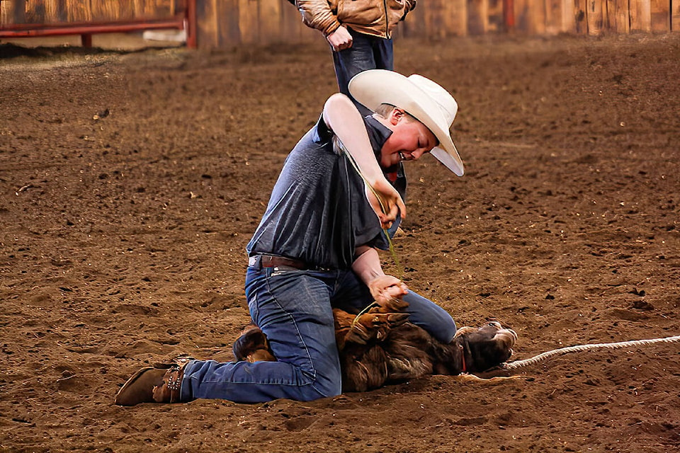 Wyatt Elder ties his sheep. (Carson Ellis photo) 