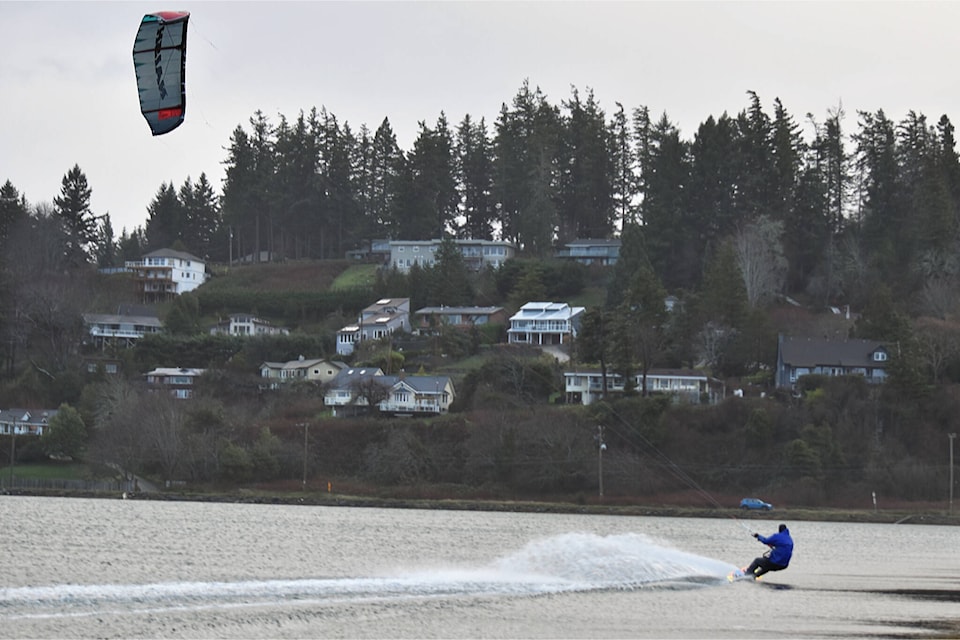 While the tempestuous weather swept through the Valley, Brian Muir decided to brave the elements and gear up to go kite surfing at Goose Spit Park on Dec. 27, 2023. (Olivier Laurin / Comox Valley Record) 
