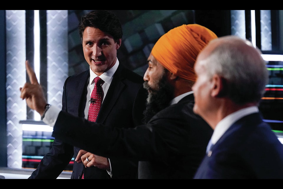 Liberal Leader Justin Trudeau, left to right, NDP Leader Jagmeet Singh, and Conservative Leader Erin O’Toole take part in the federal election English-language Leaders debate in Gatineau, Que., on Thursday, Sept. 9, 2021. Do you know which party received the greatest share of the popular vote in that election? THE CANADIAN PRESS/Adrian Wyld 