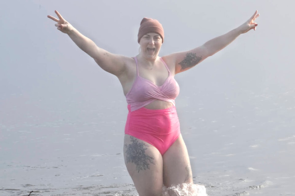 Karlee Ward was one of many people who participated in the unofficial polar plunge event at Alouette Lake on Jan. 1. (Brandon Tucker/The News) 