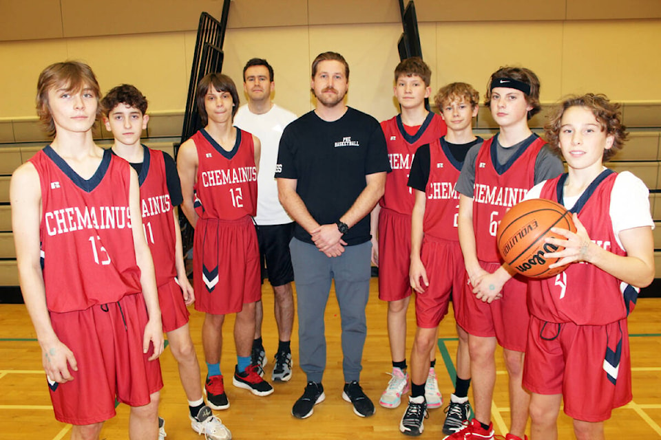 Chemainus Junior B Cougars basketball team coach Casey Parsons in the middle of some of the players. From left: Tyson Elliot, Ryan Redfern, Caiden Wilson, assistant coach Graeme Arkell, Kai Kasting, Aiden Milton, Connor Kerr, Koen de Wit.(Photo by Don Bodger) 