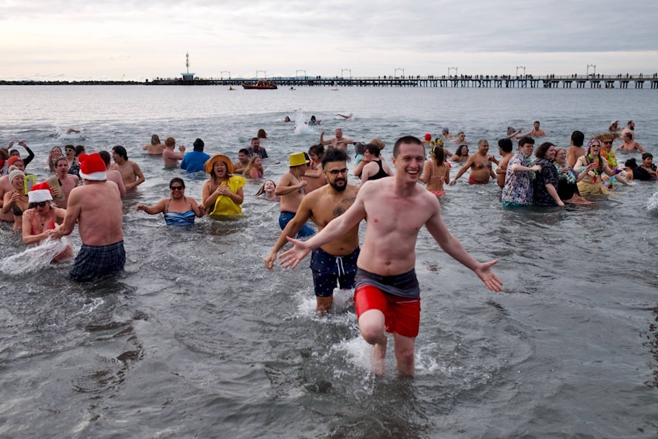 The 2024 Polar Bear Plunge drew an estimated 2,000 brave swimmers as well as a host of onlookers and supporters to the White Rock waterfront. (Geoffrey Yue/Contributed to Peace Arch News) 