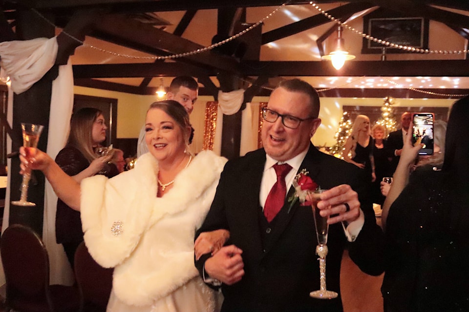 Diane and Corey Akerman celebrate after tying the knot at Historic O’Keefe Ranch Saturday, Dec. 30, 2023. (Brendan Shykora - Morning Star) 