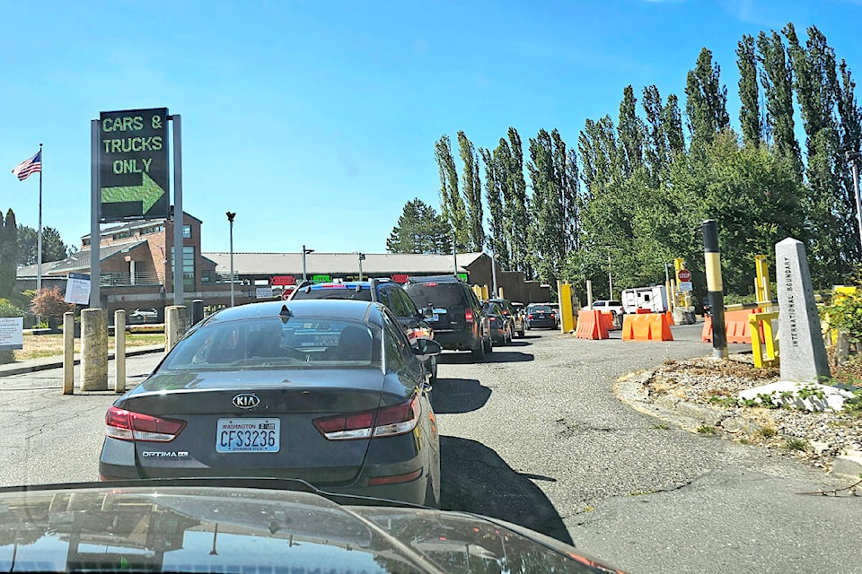 A long lineup at the Kenneth G. Ward land port of entry, in August. There are plans to modernize and expand the aging U.S. crossing, a move that is expected to lead to 24-hour service at the land port, which currently closes evenings. (Langley Advance Times files) 