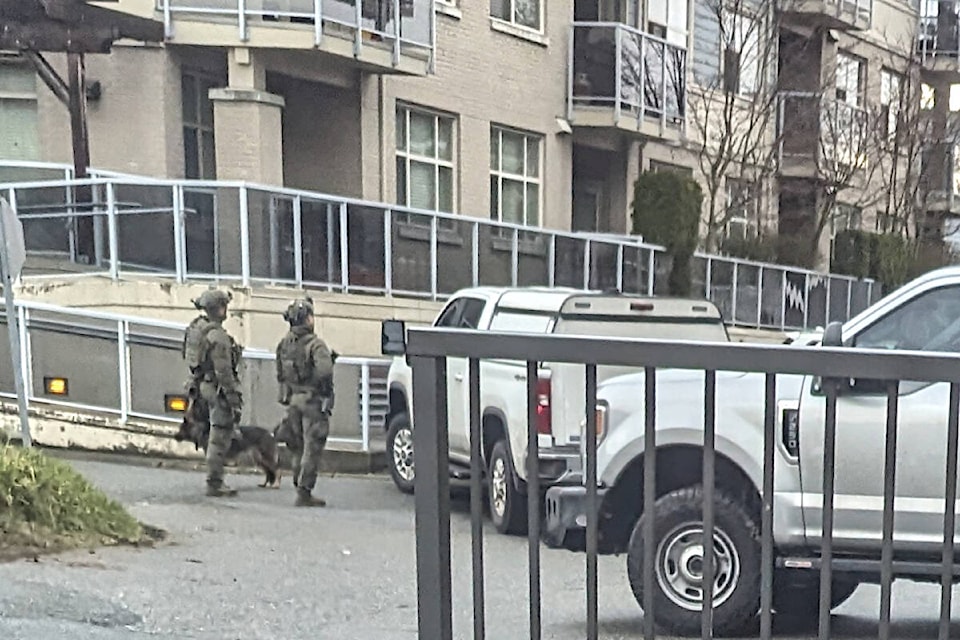  Two police officers with a police dog were among several called to the scene when a man barricaded himself inside a 91ԭ City condominium Wednesday morning, Jan. 10. (Special to 91ԭ Advance Times) 