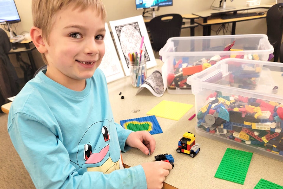  Ellis, 6, from Aldergrove came to the library with his younger brother and mom to attend the LEGO Club on Tuesday, Jan. 9. (Kyler Emerson/91ԭ Advance Times) 