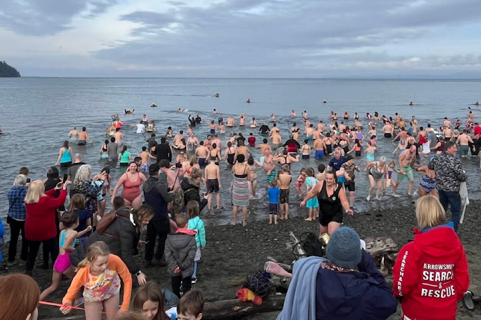 People braved the freezing waters to welcome the New Year at the 2024 Polar Bear Swim at the Parksville Beach Community Park on Jan. 1. (Percival Catbagan photo) 