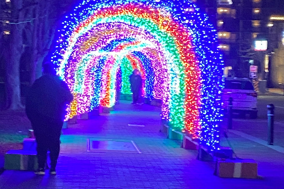 The 170 foot light tunnel on the sidewalk beside Gyro Park in downtown Penticton will stay on each night until at least past Frost Fest which takes place Jan. 20. (Monique Tamminga Western News) 