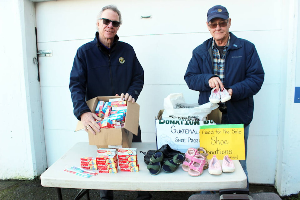 Tom Andrews, left, and Derek Hardacker are off to Guatemala carrying some extra items, including donated shoes from Queen Margaret’s School and others and dental supplies from Chemainus Family Dental. (Photo by Don Bodger) 