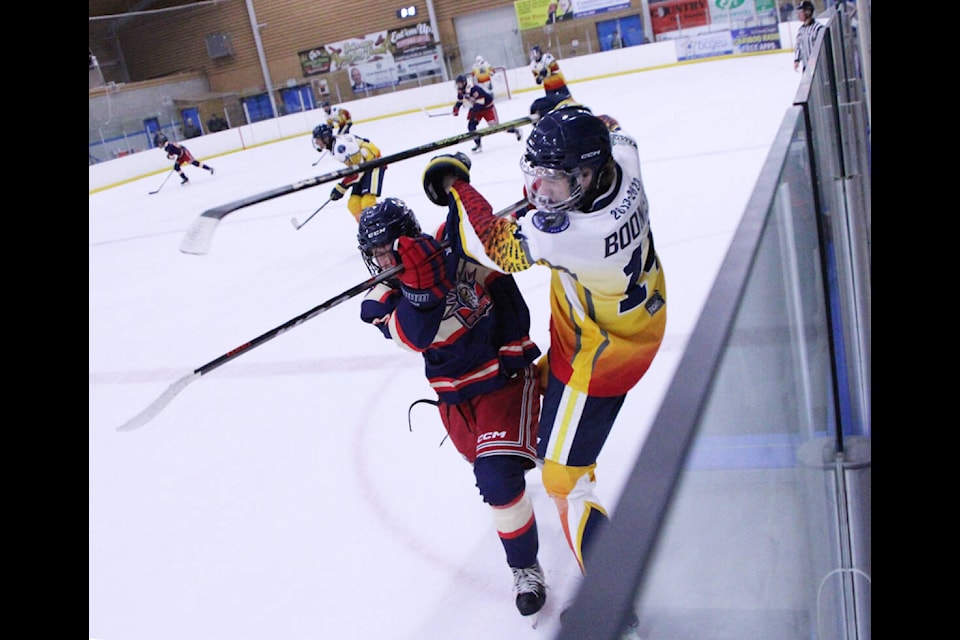 100 Mile House Wrangler Carter Boomer clashes with a Kamloops Storm player during a game Friday. (Patrick Davies photo - 100 Mile Free Press)(Patrick Davies photo - 100 Mile Free Press) 