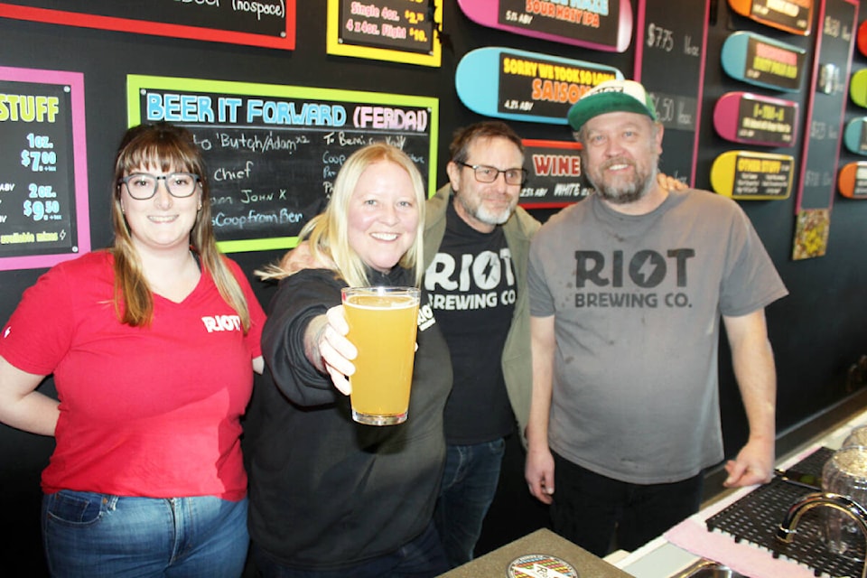 Riot Brewing Co. staffers Shay Kuhnert, Aly Tomlin, Pat Cronin and Ralf Rosenke put on brave faces in the wake of the business closure. (Photo by Don Bodger) 