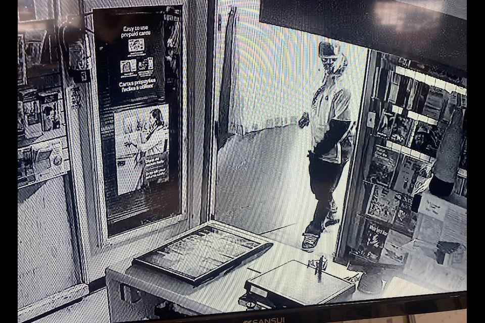 A masked individual who RCMP said entered a 108 Mile Ranch business Monday morning. (RCMP photo) 