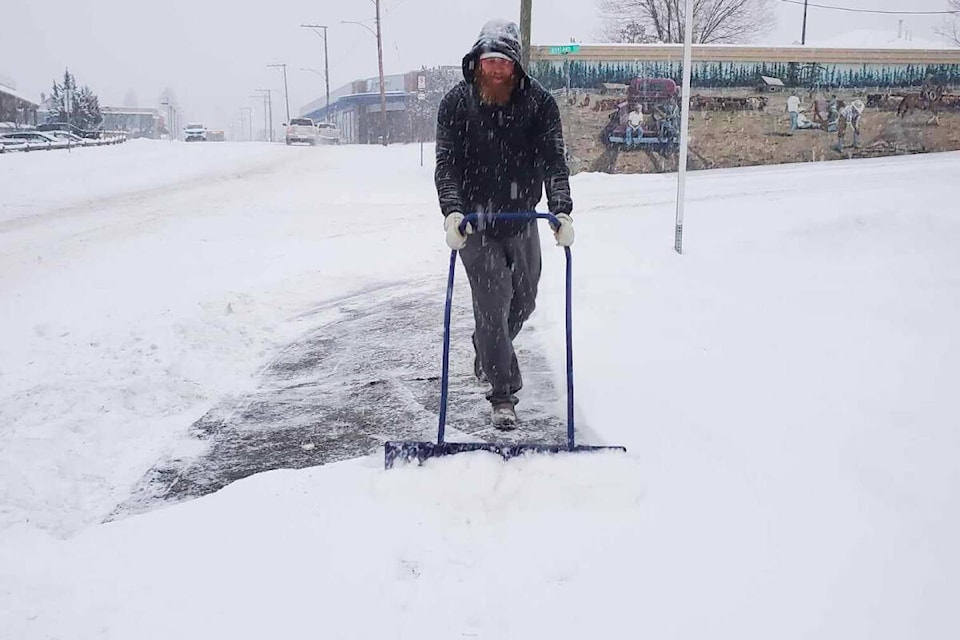 Tyler Hamm shovels snow for a client Friday, Jan. 19 in downtown Williams Lake. (Monica Lamb-Yorski photo - Efteen) 