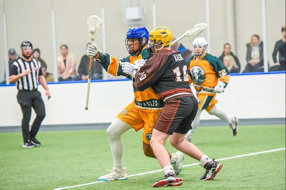 Rhys Blake and Drew Kask battle during the first quarter of their team’s Arena Lacrosse League West Division game at 91ԭ Events Centre on Jan. 21. Blake scored the winner late in the game as the Shooting Eagles defeated the Grizzlies 17-15. (Ryan Molag/Special to 91ԭ Advance Times) 