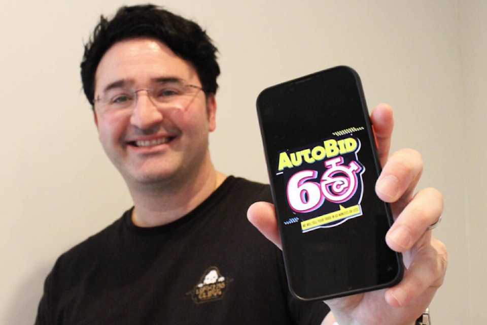 Frank Pecorelli uses the AutoBid60 app he created to help make car selling and buying easy. (1/2) (Ella Matte/News Staff) 