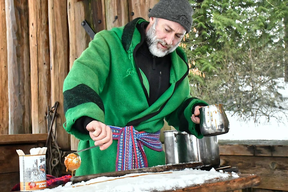  Patrick Demers, owner of Maples Sugar Shack on Granville Island, made traditional maple taffy treats at the 14th French winter festival in Fort Langley on Saturday, Jan. 20. (Kyler Emerson/Langley Advance Times) 