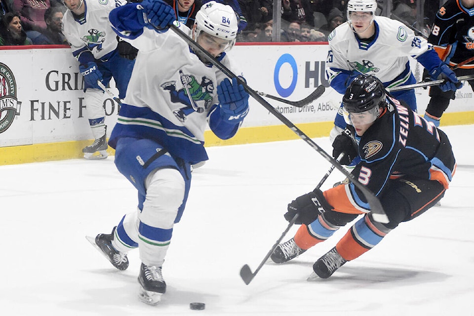 Abbotsford’s Tristen Nielsen battles for the puck against San Diego’s Olen Zellweger on Saturday (Jan. 20). (Ben Lypka/Abbotsford News) 