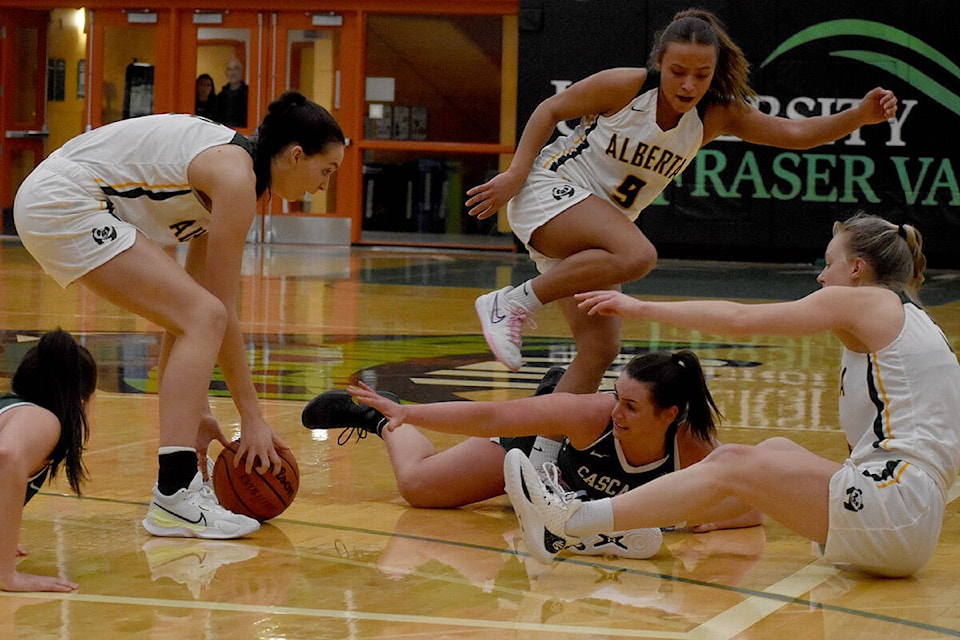 UFV’s Maddy Gobeil fights for a loose ball against Alberta on Saturday (Jan. 20). (Ben Lypka/Abbotsford News) 