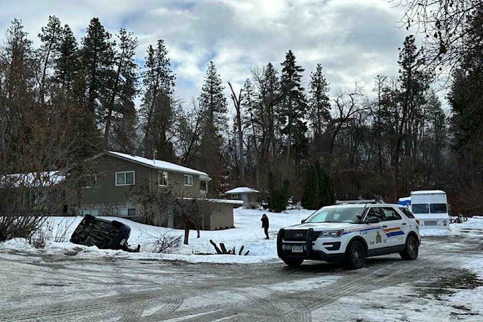A vehicle lies on its side in the yard of a home on Hollywood Road South in East 鶹ѡ on Jan. 23, 2023. (Jordy Cunningham/Capital News) 