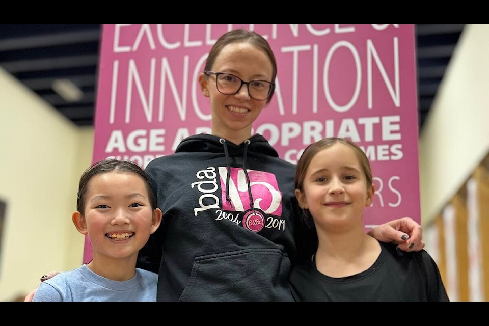 Phoenix Smith, centre, is the owner of Bella Dance Academy and is shown with two of her students: Shino Koyanagi, 9, left, and Lindyn Fraser, 9. Jill Westerman/NNSL photo 