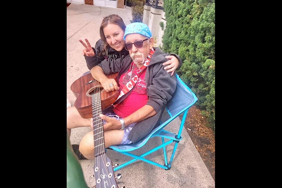 Jenifer Pilon with dad Gerald at his ‘happy place’ – the space by the Tim Hortons restaurant at 20300 Douglas Cres. in 91ԭ City where the busker would sing and play guitar, often songs of his own composition. It was where he passed away, on Jan. 21. (Special to 91ԭ Advance Times) 