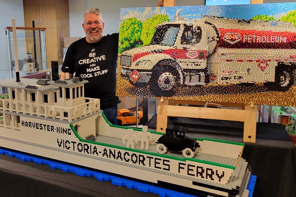 Robin Sather, one of Canada’s only Lego-certified professionals with the Peninsula Co-op Community Mosaic and his six-foot model of the Harvester-King Ferry. (Courtesy of the Sidney Museum) 