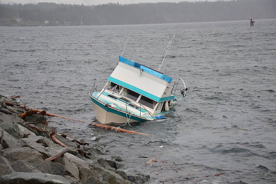 A boat broke free of its moorings in recent stormy weather and has been swamped on the breakwater of Campbell River’s Discovery Harbour Marina for a few days on Jan. 31, 2024. Photo by Alistair Taylor/Campbell River Mirror 